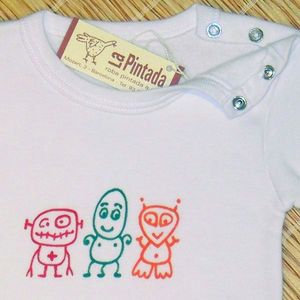 Ropa para bebés pintada a mano. La Pintada.